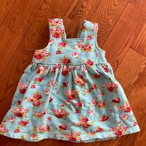 Girls pinafore apron dress in knit rose pattern